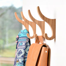 Set of two oak wooden wall hooks for coats, bags, hats, and home organization