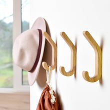Set of two minimalist wooden wall hooks for coats and home storage