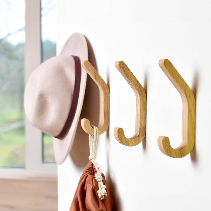 Set of two minimalist wooden wall hooks for coats and home storage