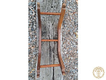 Taupe cat hammock with wooden stand for a cosy raised pet bed