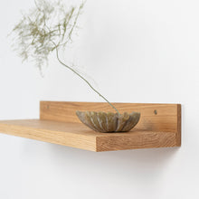 Set of two natural oak floating wall shelves for home decor and storage