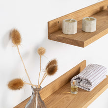 Set of two natural oak floating wall shelves for home decor and storage