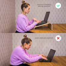 Oak wooden laptop stand with ventilation cutouts for a desk workspace