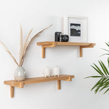 Set of two natural oak floating wall shelves with holders for home or office display