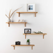 Set of two natural oak floating wall shelves with holders for home or office display